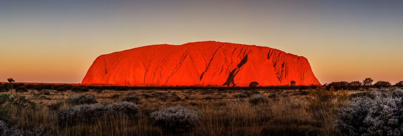 Merit For Uluru At Sunset By John Doody